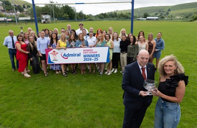 070625 - Senghenydd RFC Sirens - Senghenydd Sirens captain Shirey Webley receives the trophy from WRU representative Roy Wilkinson as the team celebrate winning the Admiral Women’s East League Title