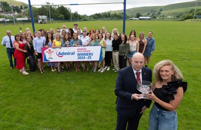 070625 - Senghenydd RFC Sirens - Senghenydd Sirens captain Shirey Webley receives the trophy from WRU representative Roy Wilkinson as the team celebrate winning the Admiral Women’s East League Title