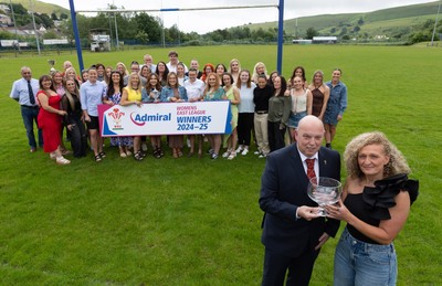 070625 - Senghenydd RFC Sirens - Senghenydd Sirens captain Shirey Webley receives the trophy from WRU representative Roy Wilkinson as the team celebrate winning the Admiral Women’s East League Title
