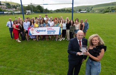 070625 - Senghenydd RFC Sirens - Senghenydd Sirens captain Shirey Webley receives the trophy from WRU representative Roy Wilkinson as the team celebrate winning the Admiral Women’s East League Title