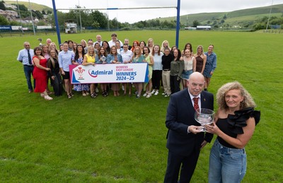 070625 - Senghenydd RFC Sirens - Senghenydd Sirens captain Shirey Webley receives the trophy from WRU representative Roy Wilkinson as the team celebrate winning the Admiral Women’s East League Title