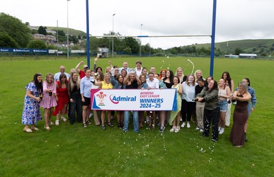 070625 - Senghenydd RFC Sirens - Senghenydd Sirens captain Shirey Webley with the trophy as the team celebrate winning the Admiral Women’s East League Title