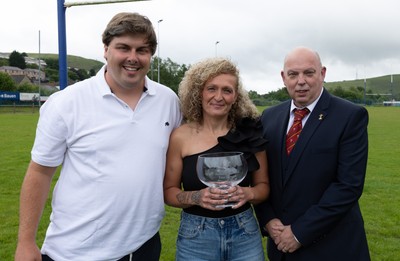 070625 - Senghenydd RFC Sirens - Senghenydd Sirens captain Shirey Webley with the trophy along with head coach Joe Harwood and WRU representative Roy Wilkinson as the team celebrate winning the Admiral Women’s East League Title