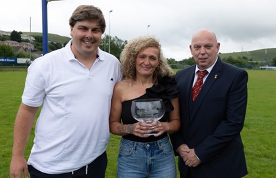 070625 - Senghenydd RFC Sirens - Senghenydd Sirens captain Shirey Webley with the trophy along with head coach Joe Harwood and WRU representative Roy Wilkinson as the team celebrate winning the Admiral Women’s East League Title