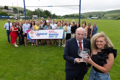 070625 - Senghenydd RFC Sirens - Senghenydd Sirens captain Shirey Webley receives the trophy from WRU representative Roy Wilkinson as the team celebrate winning the Admiral Women’s East League Title