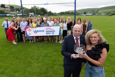 070625 - Senghenydd RFC Sirens - Senghenydd Sirens captain Shirey Webley receives the trophy from WRU representative Roy Wilkinson as the team celebrate winning the Admiral Women’s East League Title