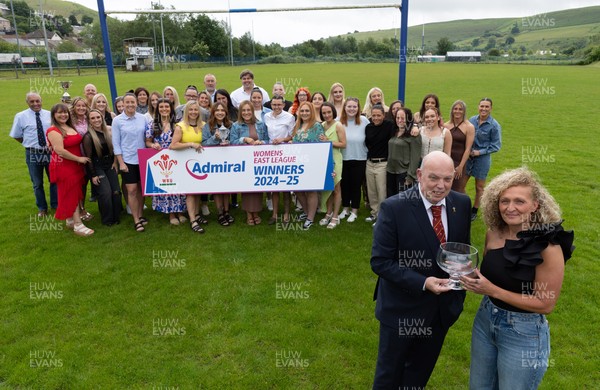 070625 - Senghenydd RFC Sirens - Senghenydd Sirens captain Shirey Webley receives the trophy from WRU representative Roy Wilkinson as the team celebrate winning the Admiral Women’s East League Title