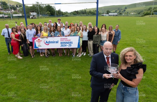 070625 - Senghenydd RFC Sirens - Senghenydd Sirens captain Shirey Webley receives the trophy from WRU representative Roy Wilkinson as the team celebrate winning the Admiral Women’s East League Title