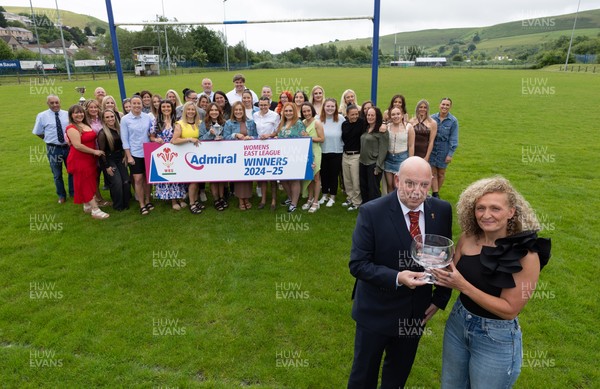 070625 - Senghenydd RFC Sirens - Senghenydd Sirens captain Shirey Webley receives the trophy from WRU representative Roy Wilkinson as the team celebrate winning the Admiral Women’s East League Title