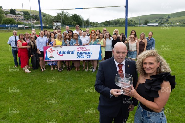 070625 - Senghenydd RFC Sirens - Senghenydd Sirens captain Shirey Webley receives the trophy from WRU representative Roy Wilkinson as the team celebrate winning the Admiral Women’s East League Title