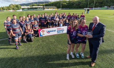 310526 - Senghenydd Sirens Admiral Womens Championship Presentation - Roy Wilkinson, WRU National Council Member presents Senghenydd Sirens co-captains, Holly Dempsey and Raf Taylor with the trophy after Sirens win the Admiral Women's National League Championship 