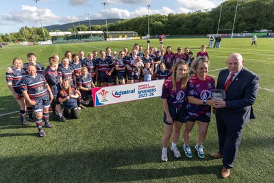 310526 - Senghenydd Sirens Admiral Womens Championship Presentation - Roy Wilkinson, WRU National Council Member presents Senghenydd Sirens co-captains, Holly Dempsey and Raf Taylor with the trophy after Sirens win the Admiral Women's National League Championship 