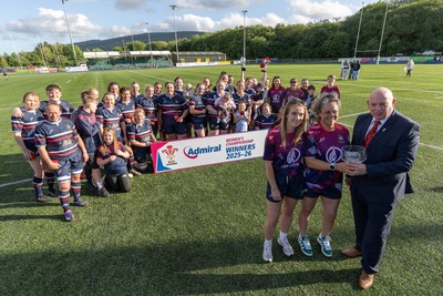 310526 - Senghenydd Sirens Admiral Womens Championship Presentation - Roy Wilkinson, WRU National Council Member presents Senghenydd Sirens co-captains, Holly Dempsey and Raf Taylor with the trophy after Sirens win the Admiral Women's National League Championship 