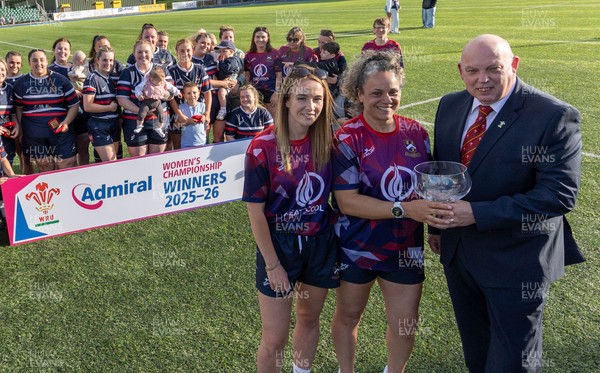 310526 - Senghenydd Sirens Admiral Womens Championship Presentation - Roy Wilkinson, WRU National Council Member presents Senghenydd Sirens co-captains, Holly Dempsey and Raf Taylor with the trophy after Sirens win the Admiral Women's National League Championship 