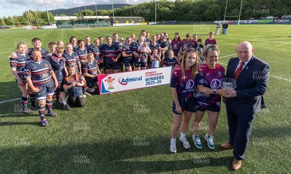 310526 - Senghenydd Sirens Admiral Womens Championship Presentation - Roy Wilkinson, WRU National Council Member presents Senghenydd Sirens co-captains, Holly Dempsey and Raf Taylor with the trophy after Sirens win the Admiral Women's National League Championship 