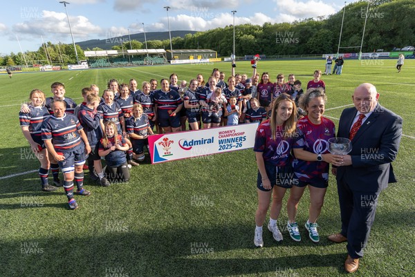310526 - Senghenydd Sirens Admiral Womens Championship Presentation - Roy Wilkinson, WRU National Council Member presents Senghenydd Sirens co-captains, Holly Dempsey and Raf Taylor with the trophy after Sirens win the Admiral Women's National League Championship 