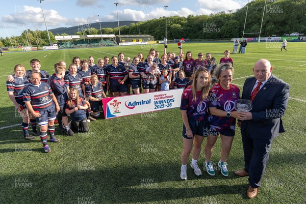 310526 - Senghenydd Sirens Admiral Womens Championship Presentation - Roy Wilkinson, WRU National Council Member presents Senghenydd Sirens co-captains, Holly Dempsey and Raf Taylor with the trophy after Sirens win the Admiral Women's National League Championship 