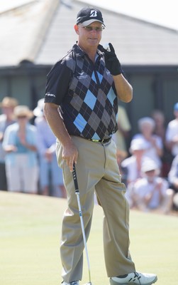 250714 -  The Senior Open Championship, Royal Porthcawl Golf Club, Wales - Sandy Lyle retrieves his ball after putting on the 9th hole