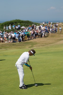 250714 -  The Senior Open Championship, Royal Porthcawl Golf Club, Wales - Bernhard Langer putts in front of the crowds on the 13th during the second round of matches