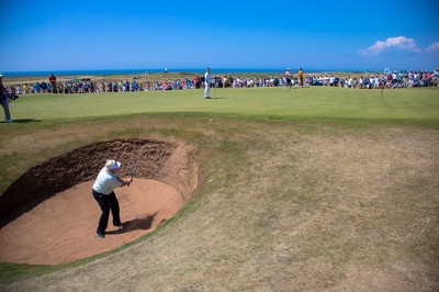 250714 -  The Senior Open Championship, Royal Porthcawl Golf Club, Wales - Mark Wiebe plays out of a bunker on the 15th 