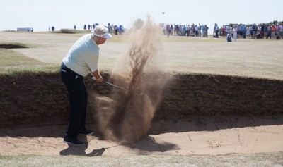 250714 -  The Senior Open Championship, Royal Porthcawl Golf Club, Wales - Mark Wiebe plays out of a bunker