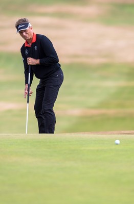 270714 -  The Senior Open Championship, Royal Porthcawl Golf Club, Wales - Bernhard Langer attempts a long range putt on the four green during the final round of the Senior Open at Royal Porthcawl Golf Club