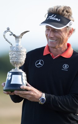 270714 -  The Senior Open Championship, Royal Porthcawl Golf Club, Wales - Germany's Bernhard Langer celebrates with the trophy after winning the Senior Open at Royal Porthcawl Golf Club by 13 shots