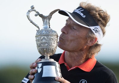 270714 -  The Senior Open Championship, Royal Porthcawl Golf Club, Wales - Germany's Bernhard Langer celebrates with the trophy after winning the Senior Open at Royal Porthcawl Golf Club by 13 shots