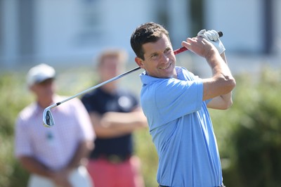 220714 -  The Senior Open Pro Am Competition, Royal Porthcawl Golf Club, Wales - Former Tennis star Tim Henman who was playing in the Pro Am with Sandy Lyle plays his tee shot 