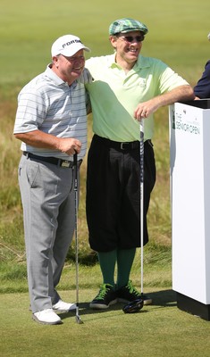 220714 -  The Senior Open Pro Am Competition, Royal Porthcawl Golf Club, Wales - Henry Englehardt , Chief Executive of  Admiral Insurance Group shares a joke with his professional partner Ian Woosnam before the start of their match 