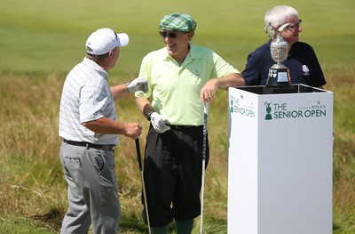 220714 -  The Senior Open Pro Am Competition, Royal Porthcawl Golf Club, Wales - Henry Englehardt , Chief Executive of  Admiral Insurance Group shares a joke with his professional partner Ian Woosnam before the start of their match 