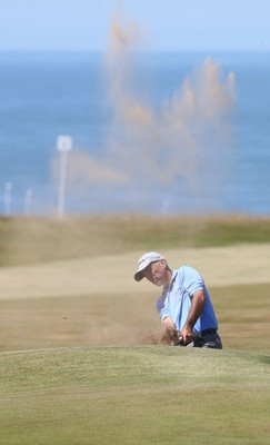 220714 -  The Senior Open Pro Am Competition, Royal Porthcawl Golf Club, Wales - Cory Pavin of the USA plays out of a bunker during the Pro Am Tournament played ahead of the start of the Senior Open 2014 