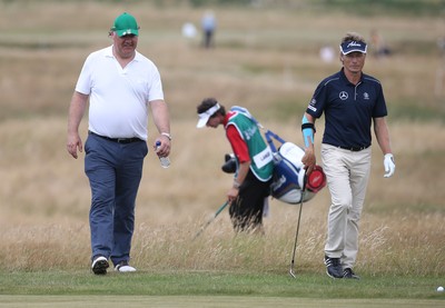 220714 -  The Senior Open Pro Am Competition, Royal Porthcawl Golf Club, Wales - Opera star Bryn Terfel with his professional partner Bernhard Langer of Germany during the Pro Am Tournament played ahead of the start of the Senior Open 2014 