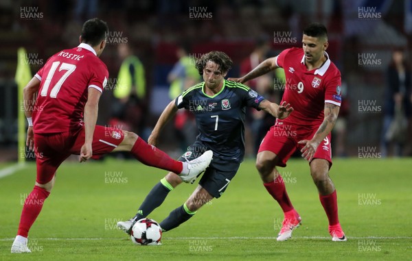 110617 Serbia v Wales Joe Allen  tries to go past Aleksandar Mitrovic(rt) and Kostic(lt)