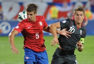 110912 - Serbia v Wales - 2014 World Cup Qualifier -Matija NASTASIC of Serbia and Aaron Ramsey of Wales compete