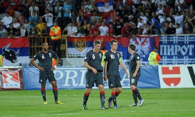 110912 - Serbia v Wales - 2014 World Cup Qualifier -Ashley Williams, Steven Morison, Aaron Ramsey and David Vaughan look dejected at the end of the game