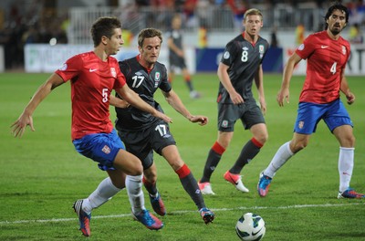 110912 - Serbia v Wales - 2014 World Cup Qualifier -Aleksandar IGNJOVSKI of Wales and Matija NASTASIC of Serbia compete
