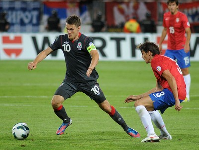 110912 - Serbia v Wales - 2014 World Cup Qualifier -Aaron Ramsey of Wales and Ljubomir FEJSA of Serbia compete