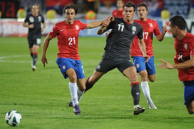 110912 - Serbia v Wales - 2014 World Cup Qualifier -Gareth Bale of Wales competes with Lazar MARKOVIC of Serbia