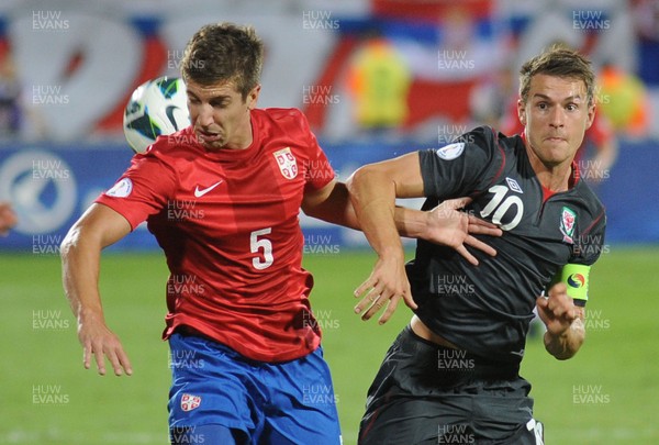 110912 - Serbia v Wales - 2014 World Cup Qualifier -Matija NASTASIC of Serbia and Aaron Ramsey of Wales compete