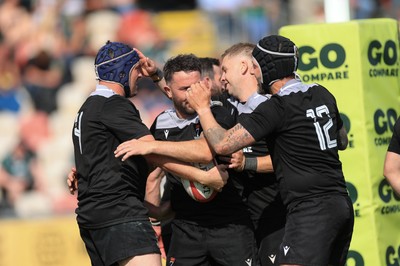 100525 - Seven Sisters v Gwernyfed, Mens Division 4 Cup Final - Team mates celebrate with Craig Kendall of Seven Sisters  after he races in to score try