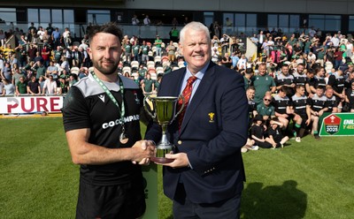 100525 - Seven Sisters v Gwernyfed, Mens Division 4 Cup Final - Seven Sisters captain Kyle Davies receives the Division 4 trophy from WRU representative Jeff Davies