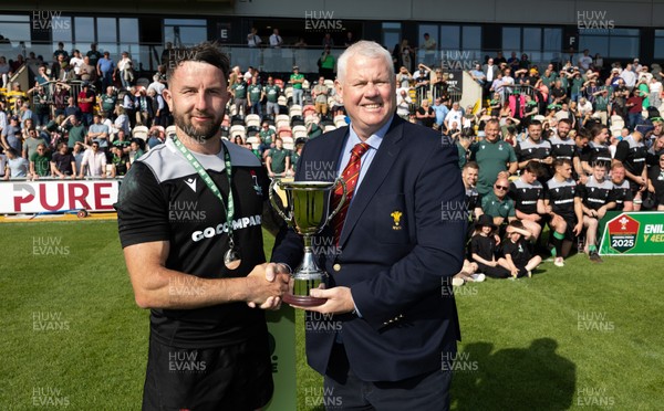 100525 - Seven Sisters v Gwernyfed, Mens Division 4 Cup Final - Seven Sisters captain Kyle Davies receives the Division 4 trophy from WRU representative Jeff Davies