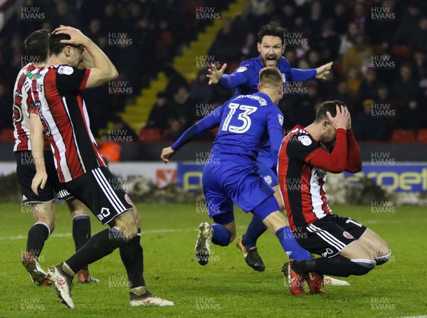 020418 - Sheffield United v Cardiff City, Sky Bet Championship -Anthony Pilkington of Cardiff City and Sean Morrison of Cardiff City celebrate as Pilkington scores  the equaliser while Sheffield United players show the despair