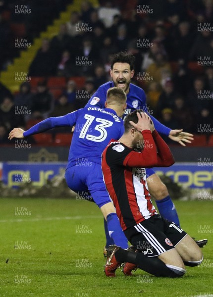 020418 - Sheffield United v Cardiff City, Sky Bet Championship -Anthony Pilkington of Cardiff City and Sean Morrison of Cardiff City celebrate as Pilkington scores  the equaliser while Sheffield United players show the despair