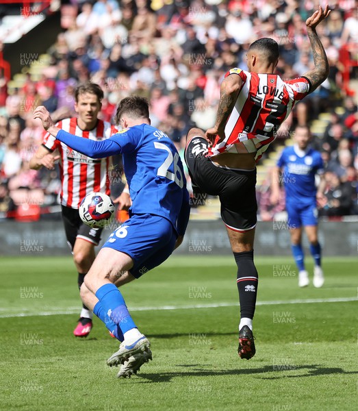 150423 - Sheffield United v Cardiff City - Sky Bet Championship - Jack Simpson of Cardiff is brought down by Max Lowe of Sheffield Utd in the box penalty given