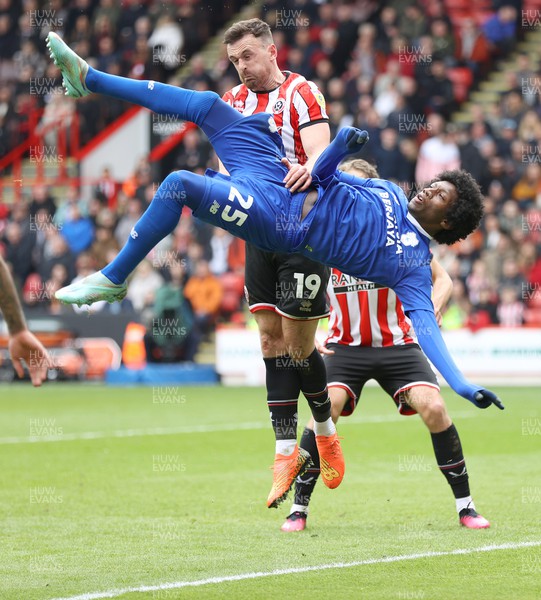 150423 - Sheffield United v Cardiff City - Sky Bet Championship - Jaden Philogene of Cardiff tries an overhead by the goal but not successful due to hands on by Jack Robinson of Sheffield Utd