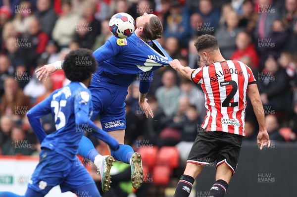 150423 - Sheffield United v Cardiff City - Sky Bet Championship - Connor Wickham of Cardiff is prevented from heading the ball by George Baldock of Sheffield Utd pulling his shirt