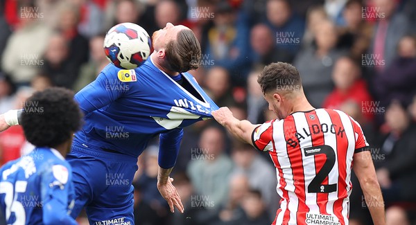 150423 - Sheffield United v Cardiff City - Sky Bet Championship - Connor Wickham of Cardiff is prevented from heading the ball by George Baldock of Sheffield Utd pulling his shirt