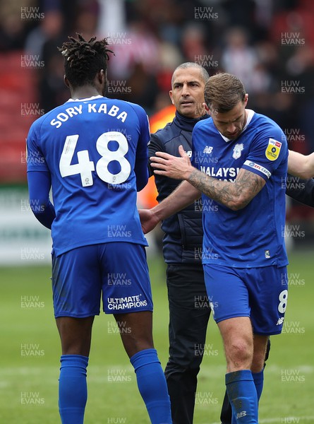 150423 - Sheffield United v Cardiff City - Sky Bet Championship - Sory Kaba of Cardiff and Joe Ralls of Cardiff are greeted by Manager Sabri Lamouchi of Cardiff at the end of the match